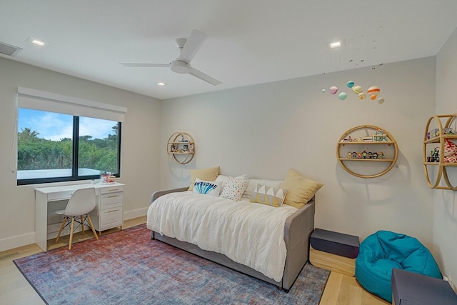 bedroom featuring light wood-type flooring and ceiling fan