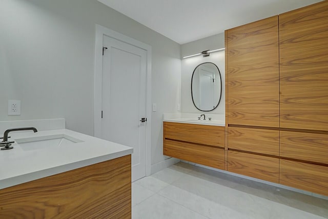 bathroom featuring tile patterned floors and vanity