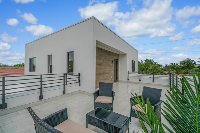 view of patio with a balcony