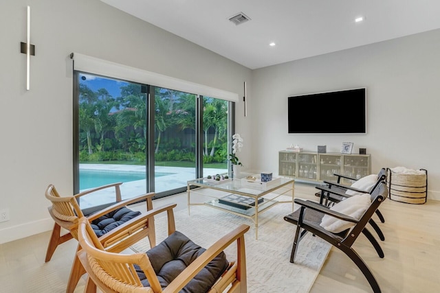 living room with light hardwood / wood-style floors