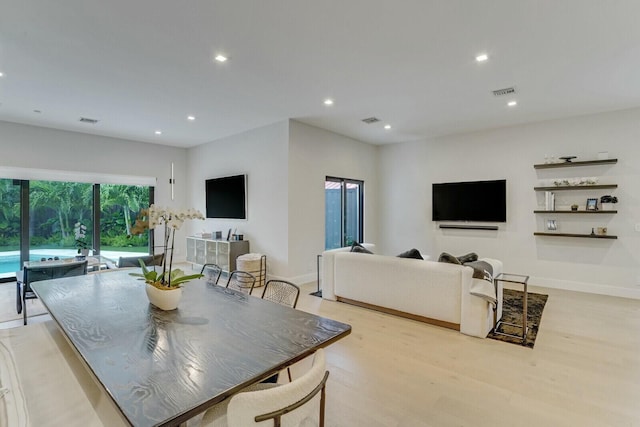 dining area with light hardwood / wood-style flooring