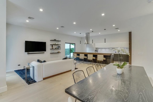 dining space with light wood-type flooring