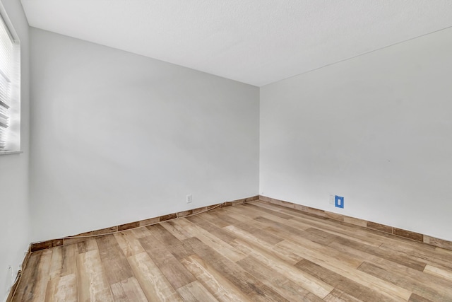 unfurnished room featuring light wood-type flooring