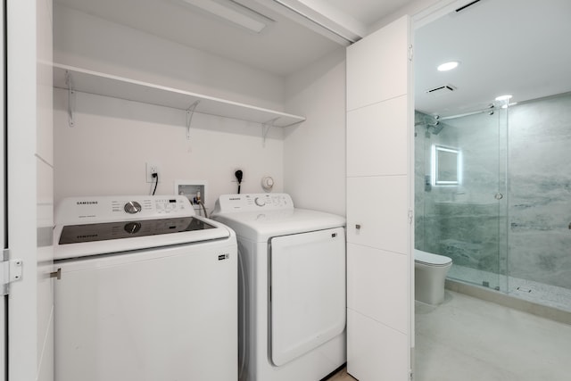 washroom featuring washer and clothes dryer