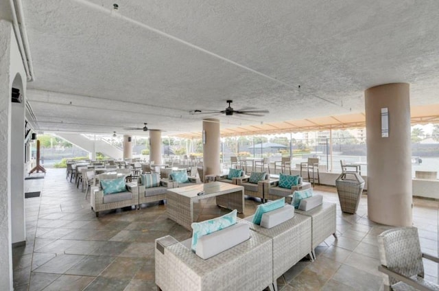 view of patio with ceiling fan and an outdoor hangout area