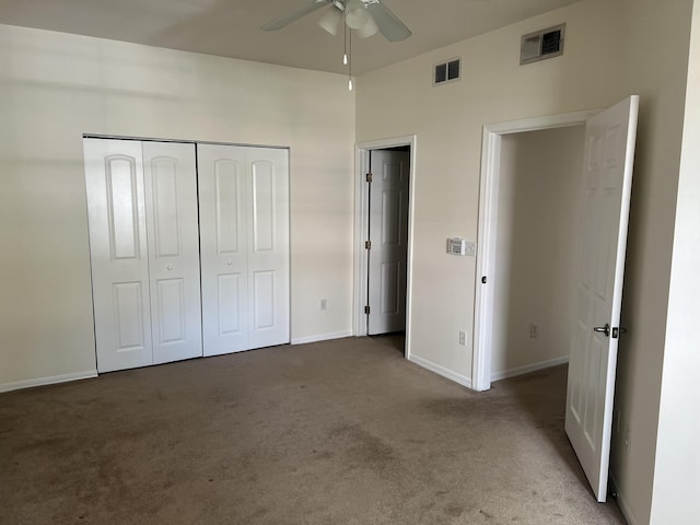 unfurnished bedroom with carpet, a closet, visible vents, and baseboards