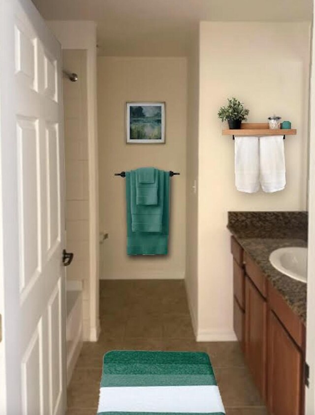 full bathroom featuring baseboards, vanity, shower / bathtub combination, and tile patterned floors