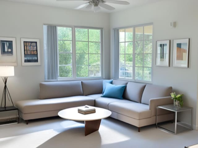 living area with carpet floors and a ceiling fan