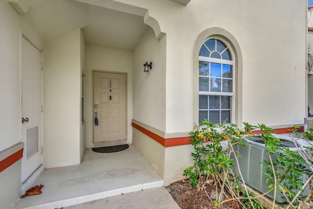 doorway to property with central air condition unit