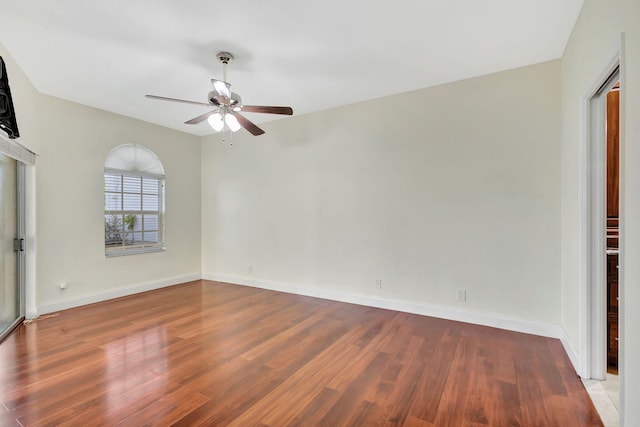 empty room featuring ceiling fan and wood-type flooring