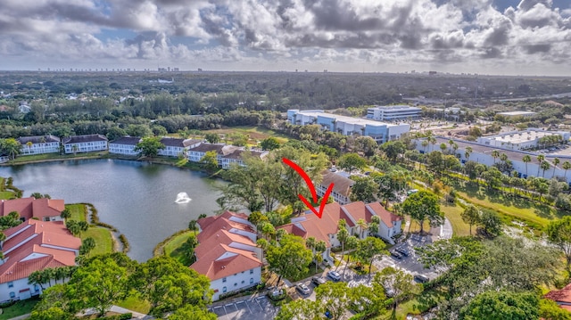 birds eye view of property with a water view