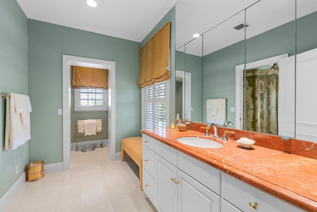 bathroom with tile patterned flooring, vanity, and ornamental molding