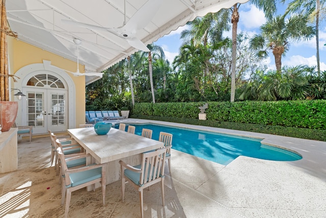 view of pool featuring a patio area and french doors