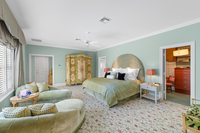 bedroom featuring ceiling fan, light colored carpet, and ornamental molding