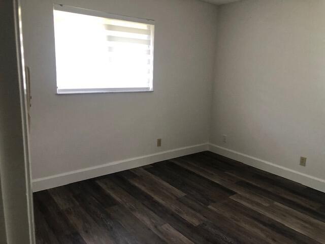 7630 Lago Del Mar Dr Unit 1, Boca Raton, FL 33433 - unfurnished room with dark wood-type flooring