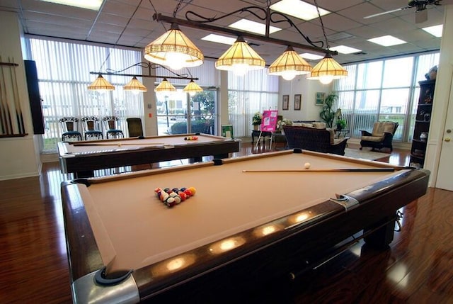 recreation room with expansive windows, wood-type flooring, billiards, and a wealth of natural light