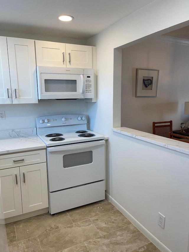 kitchen with white cabinets, white appliances, and ornamental molding