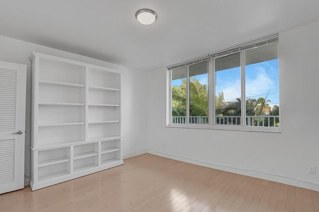 spare room featuring hardwood / wood-style floors