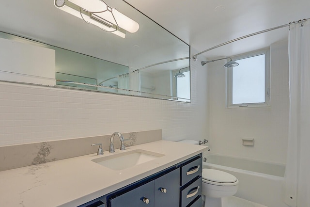 full bathroom with shower / bath combo, toilet, and vanity