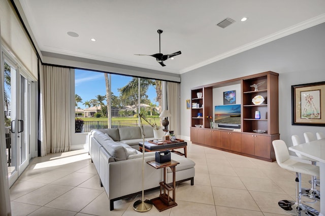 tiled living room with a wealth of natural light, crown molding, and ceiling fan