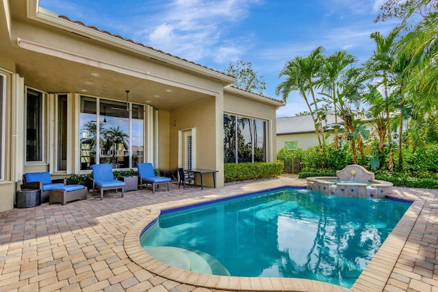 view of swimming pool with an in ground hot tub and a patio