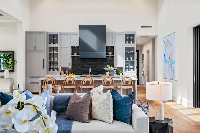 321 NW 7th St, Delray Beach, FL 33444 - living room with a high ceiling and light wood-style floors