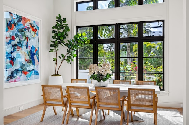 321 NW 7th St, Delray Beach, FL 33444 - dining space featuring light wood-style flooring and baseboards