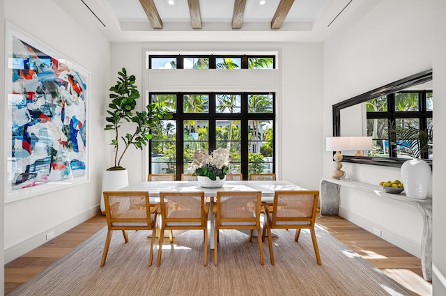 321 NW 7th St, Delray Beach, FL 33444 - dining space featuring light wood finished floors, beam ceiling, and healthy amount of natural light