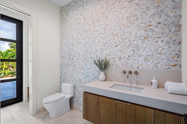 321 NW 7th St, Delray Beach, FL 33444 - bathroom with wallpapered walls, vanity, and tile patterned floors