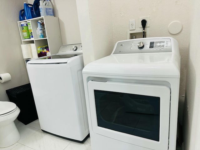 laundry room with washer and clothes dryer