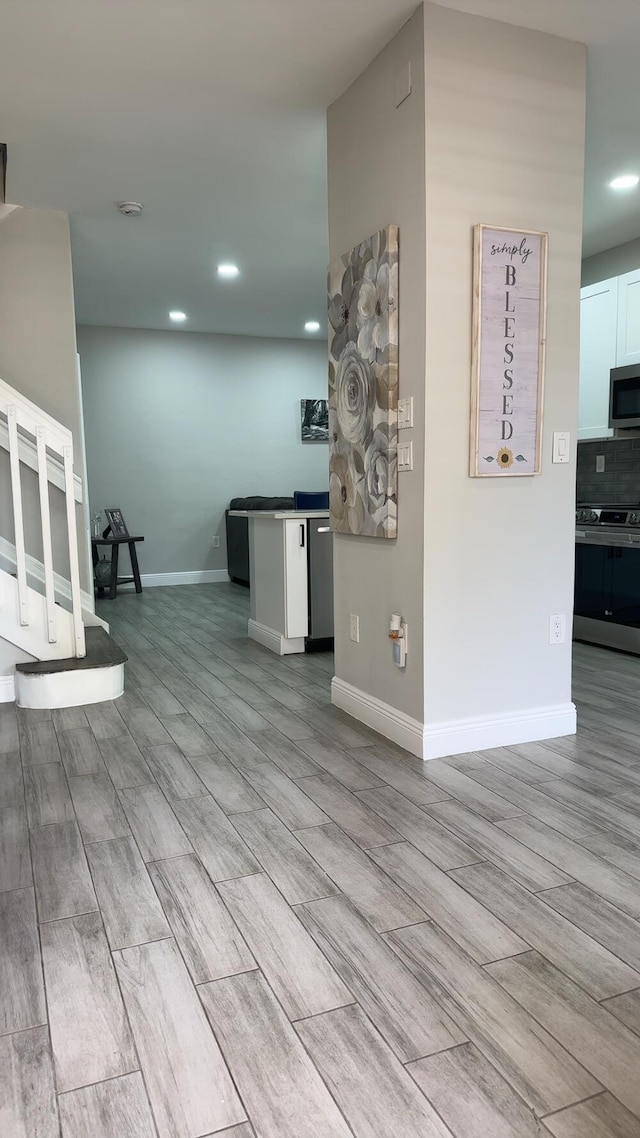 unfurnished living room with light wood-type flooring