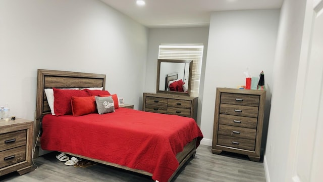 bedroom with light hardwood / wood-style floors