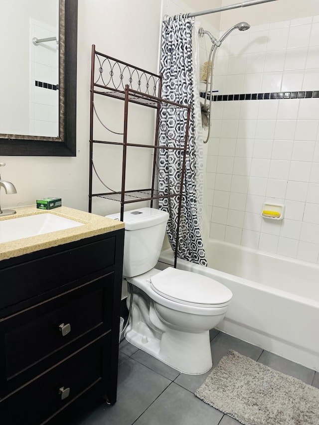 full bathroom with tile patterned floors, vanity, shower / tub combo, and toilet