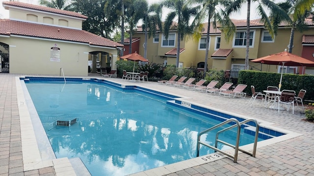 view of swimming pool featuring a patio area