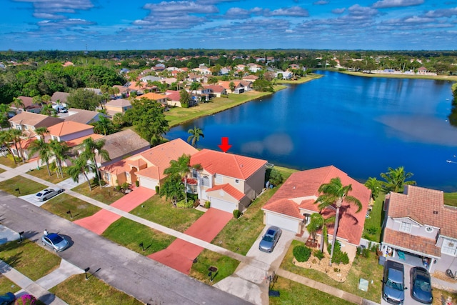 drone / aerial view with a water view