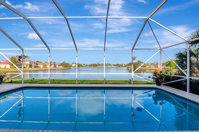 view of pool featuring a water view and a lanai