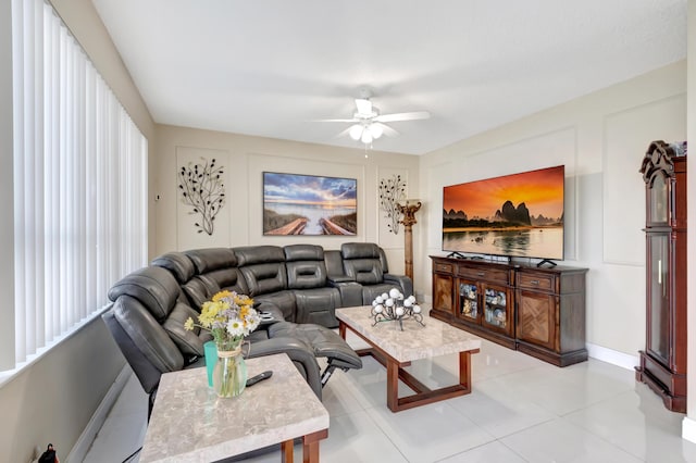 tiled living room with ceiling fan