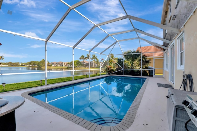 view of pool with a water view, a patio, and a lanai