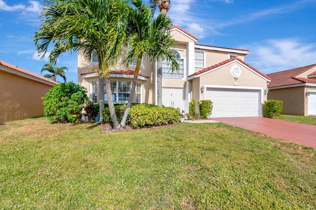 mediterranean / spanish house with a garage and a front yard