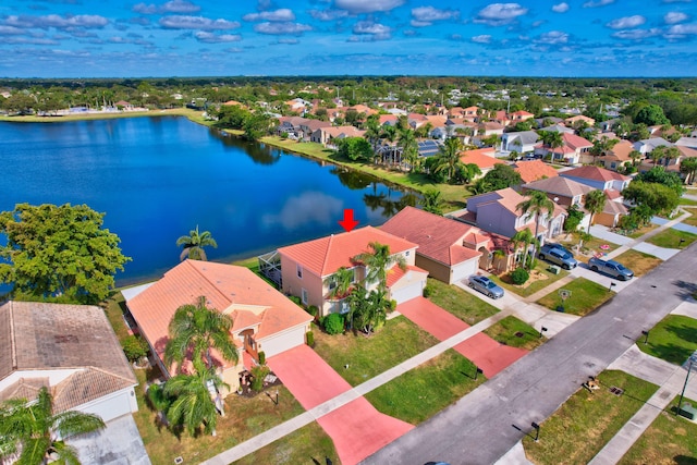 birds eye view of property featuring a water view