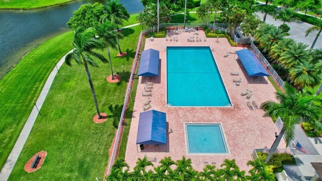 view of pool with a water view