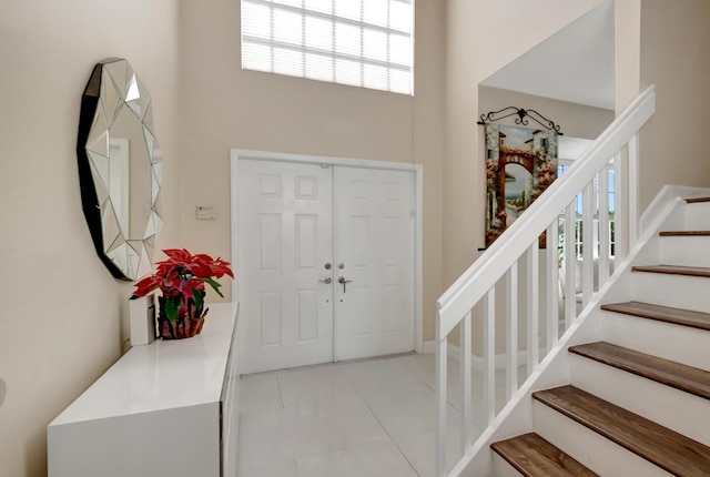 entrance foyer with light tile patterned floors