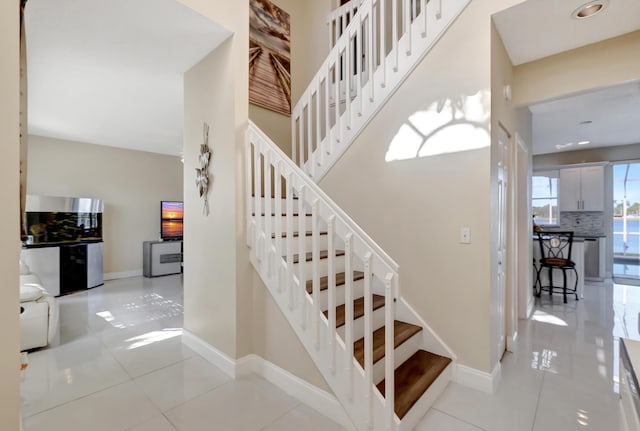 stairway featuring tile patterned floors