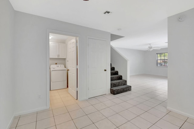 interior space featuring tile patterned floors, ceiling fan, and washer / clothes dryer