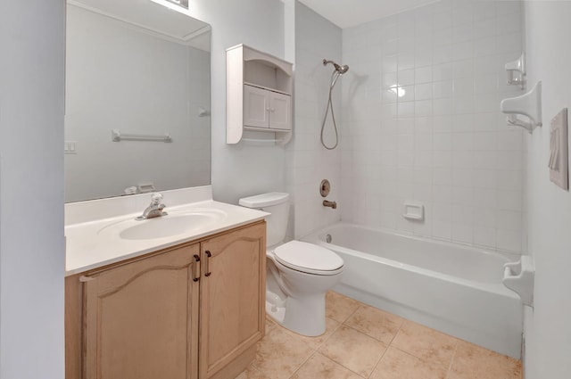 full bathroom featuring tile patterned floors, tiled shower / bath, vanity, and toilet