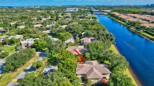 birds eye view of property featuring a water view