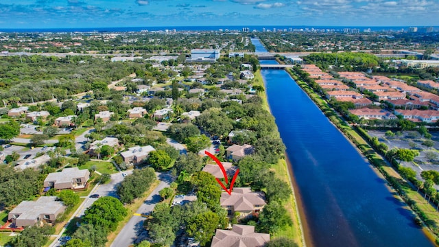 birds eye view of property featuring a water view