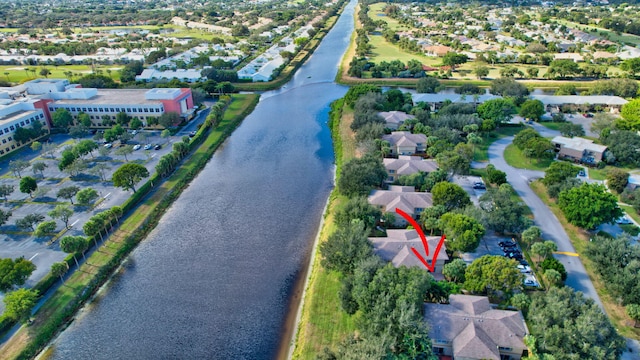 drone / aerial view with a water view