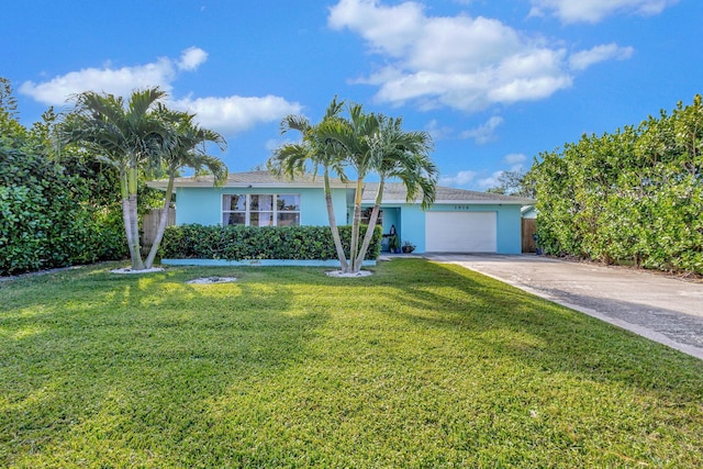 view of front of home with a garage and a front yard