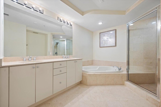 bathroom featuring tile patterned flooring, vanity, and separate shower and tub